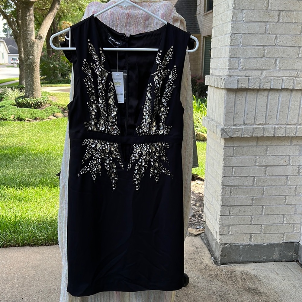 BEBE cocktail Black Dress Size 4, never worn perfect condition